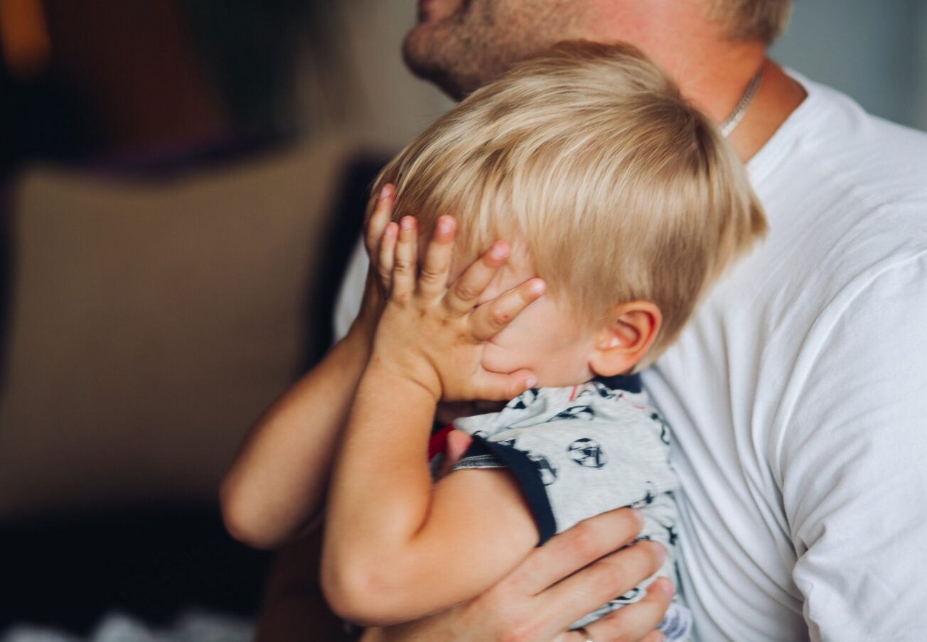 The baby is crying. The little boy is crying heavily.